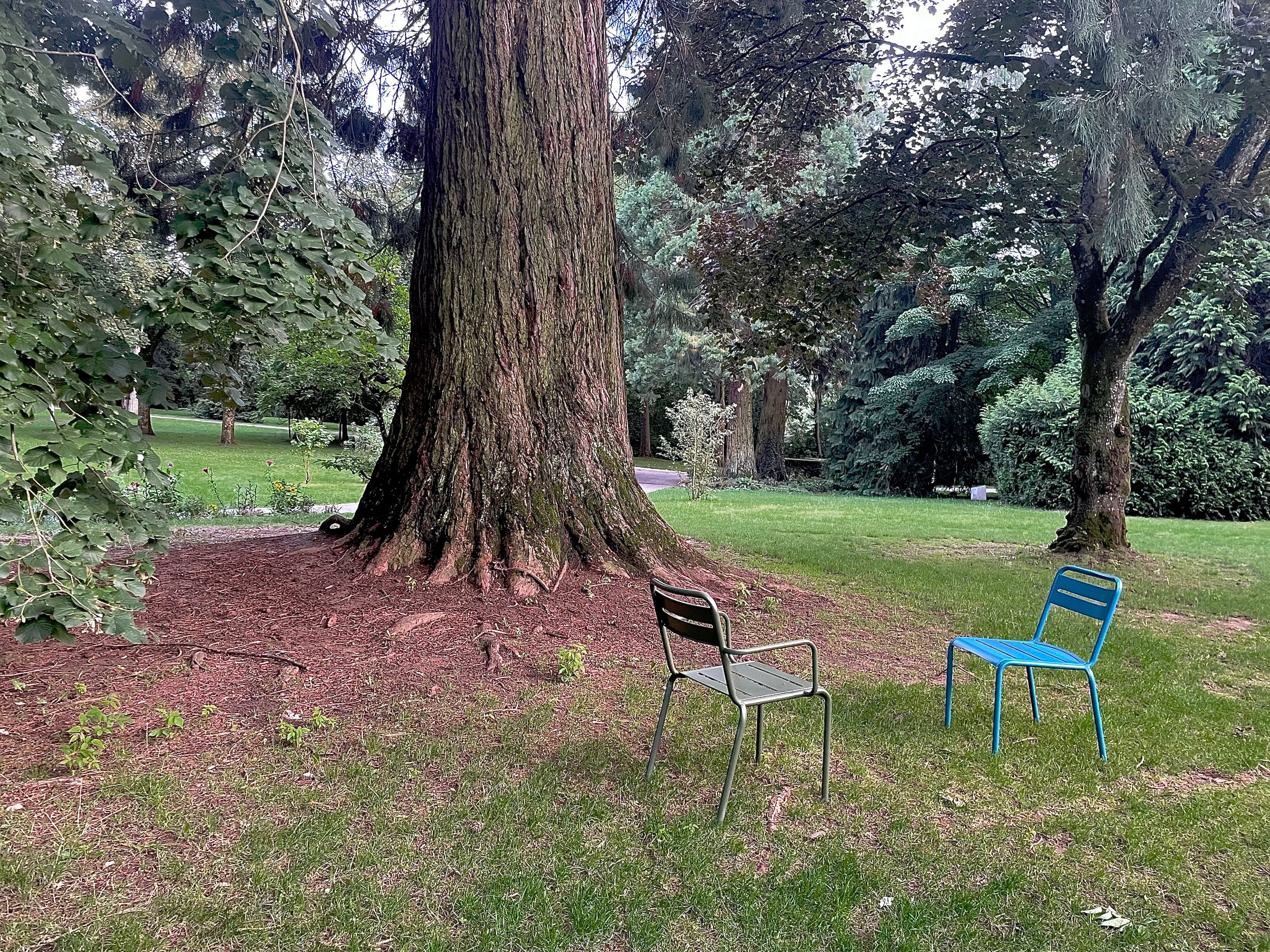 Two chairs facing each other at Tony Neuman Park, in Luxembourg.